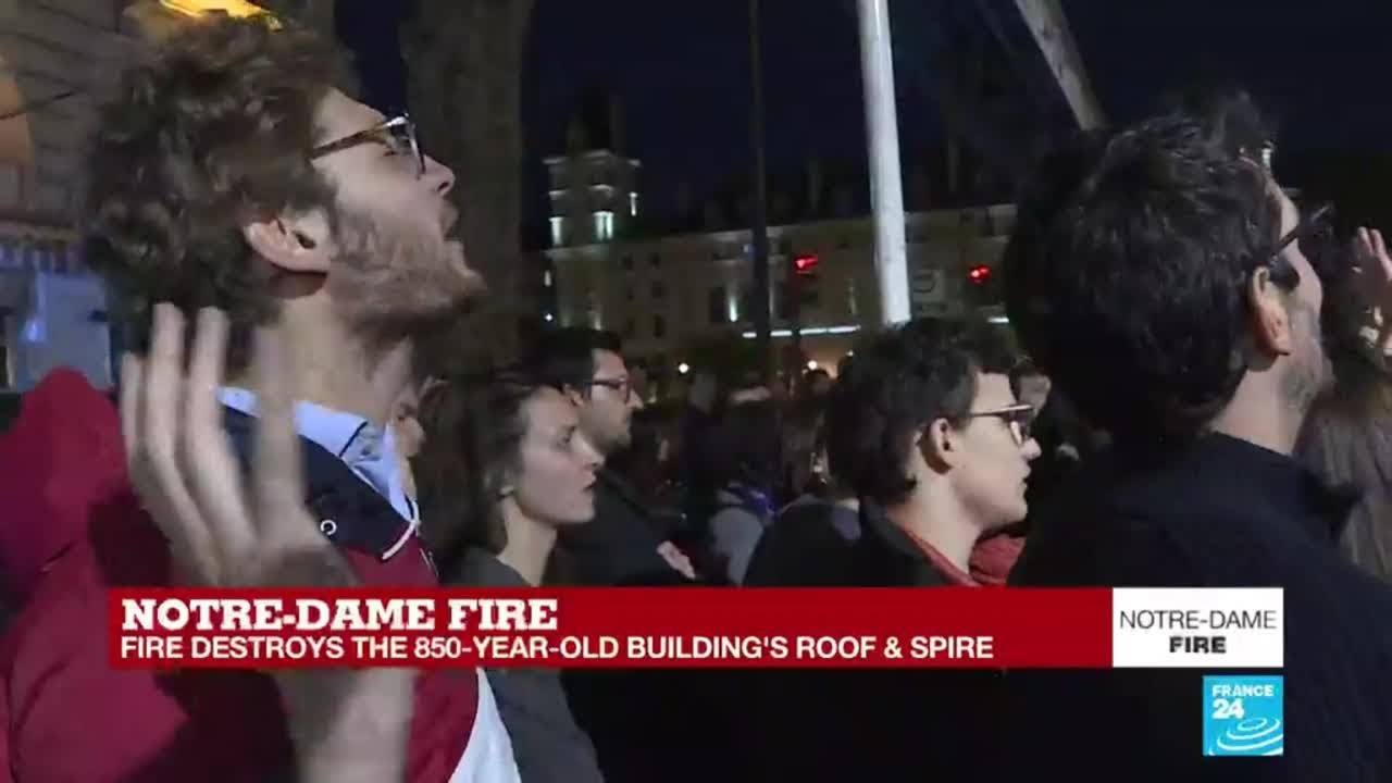 Notre-Dame fire: Parisians, tourists sing and pray for Cathedral