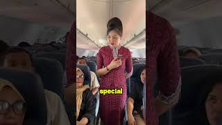 Why do flight attendants hide their hands behind their backs?