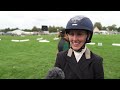 Katie Magee gets a lift from the Defender Burghley crowd
