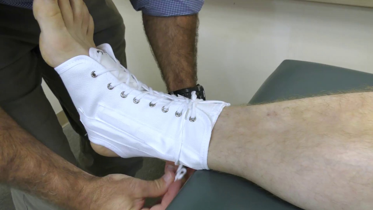 How To Wear a Canvas Lace Up Ankle Brace - YouTube