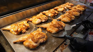 Crispy rice with grilled chicken on an iron plate - korean street food