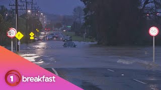 Vehicle stranded in flooded road in West Auckland Vehicle stranded in flooded road in West Auckland