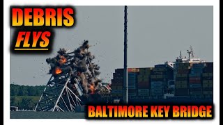 Debris flys during the Key Bridge Span Demolition on the Dali in Baltimore Harbor