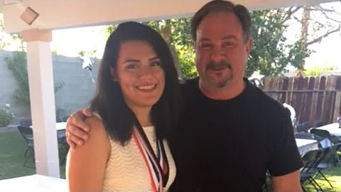 Cop Celebrates Graduation of Baby He Saved From Gu...