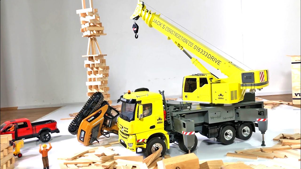 Play: A calm sandbox toy construction crane demonstration