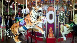 Riding Carousel Merry-go-Round. ะะฐัััะตะปั.