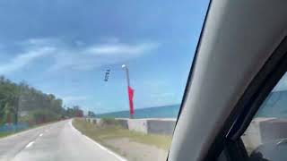 Driving at the Nationalroad in Bohol Philippines. Nice ocean view.