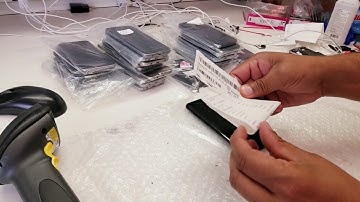 Cell phone grading, testing and IMEI recording system with bar code printing and report printing.