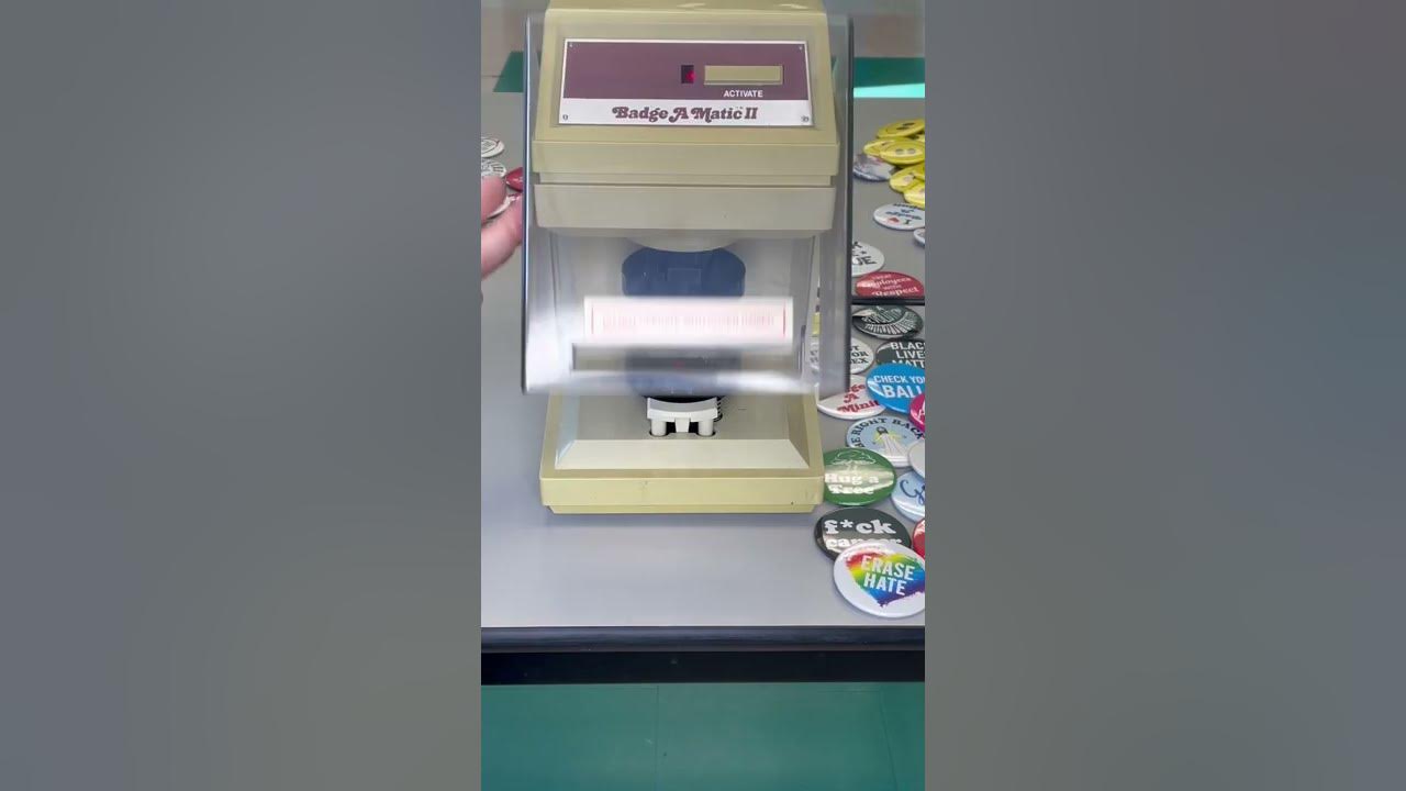 Making a button with the badge a minit automatic button making machine
