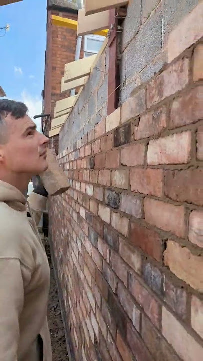 Bricklayer using reclaimed bricks #construction #renovation #extension