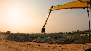 Komatsu Long-Reach Excavator Building Saltwater Flood Barrier for the Community":