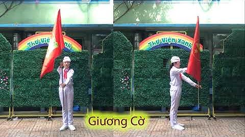 Giương cờ - Từ tư thế cầm cờ nghiêm chuyển sang giương cờ: