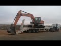 How to load a track excavator on to a trailer.