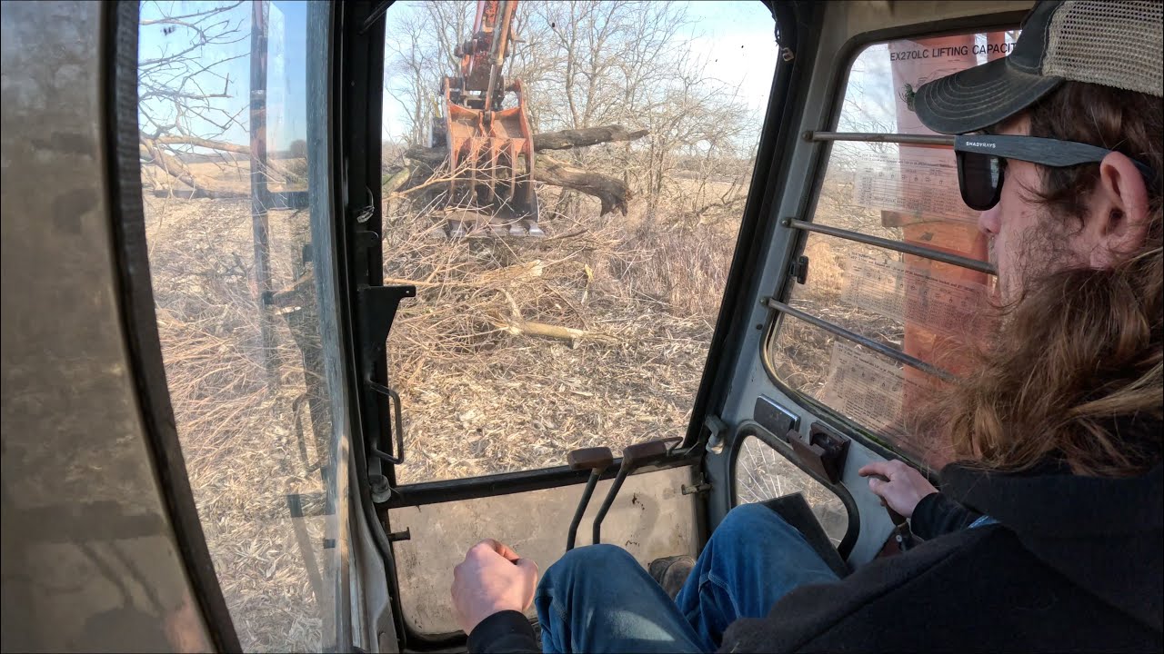 Clearing a fence row - YouTube