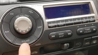 How to set the clock on a 2008 Honda Fit radio