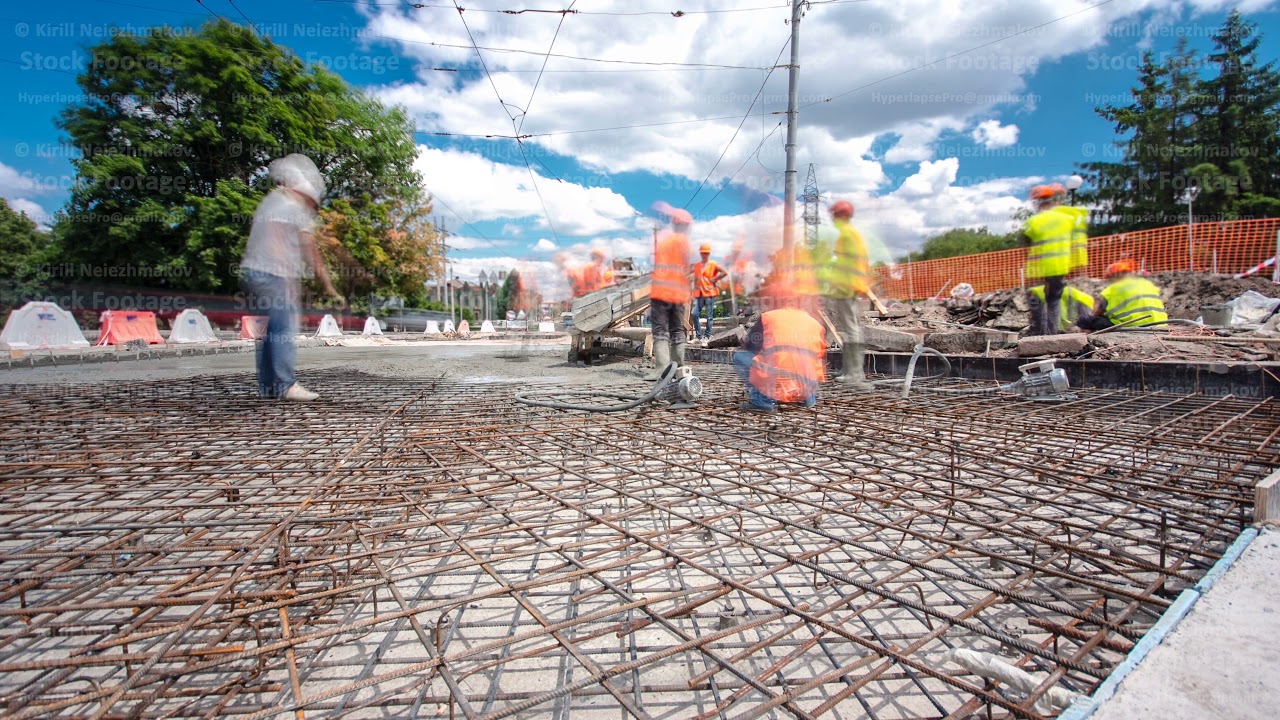 Concrete works for road construction with many workers and mixer timelapse hyperlapse