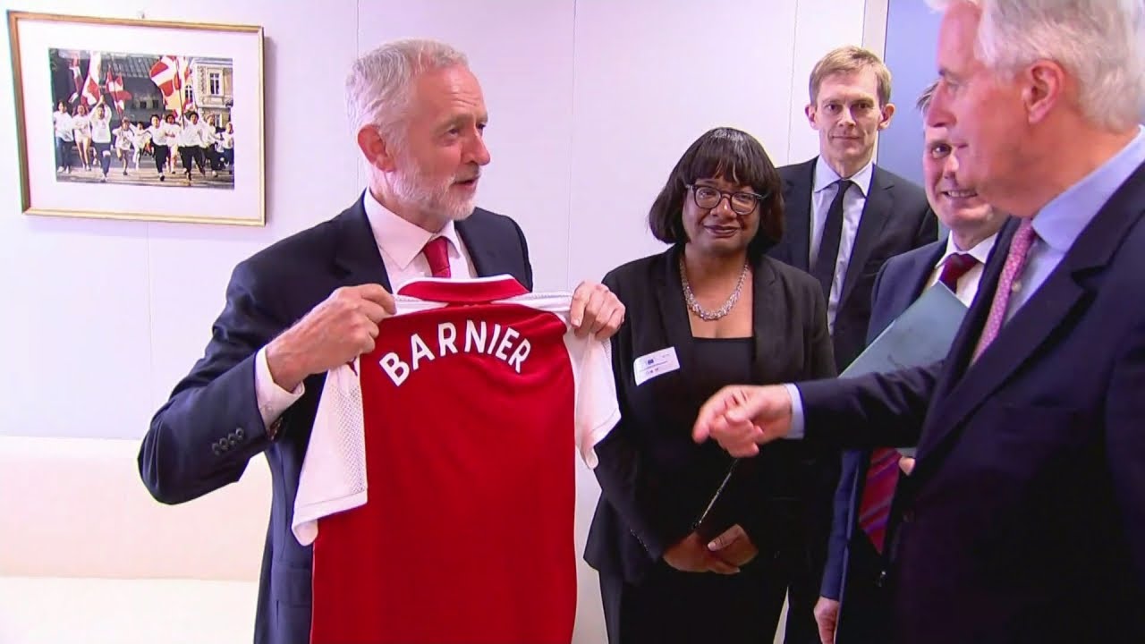 Jeremy Corbyn gives EU's chief negotiator an Arsenal shirt