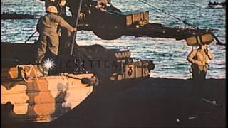 US Marines advance towards the Iwo Jima beach and carry the wounded to safe place...HD Stock Footage