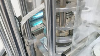 Vacuum cups filling sealing machine rotary type single head cream filler sealer for Chilean customer
