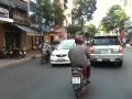 Driving through Saigon on the back of a scooter