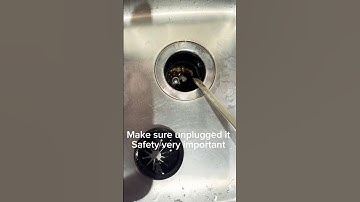 How to fix the GE garbage disposal not working, using long screw driver very easy