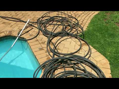 Swimming pool solar heater with irrigation pipe