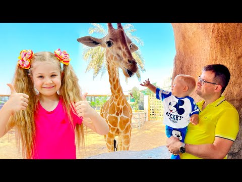 Diana and Roma feed the animals at the Emirates Park Zoo