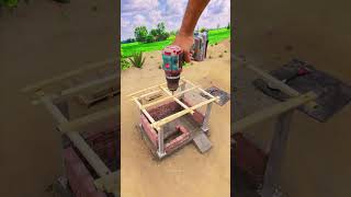 Building a tiny cow shed using small bricks.