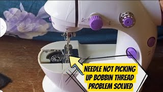 Mini sewing machine needle not catching the bobbin thread problem solved.