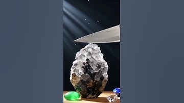 Cinematic super-sharp knife slicing through minerals: obsidian, quartz, sapphire, emerald, jade, dia
