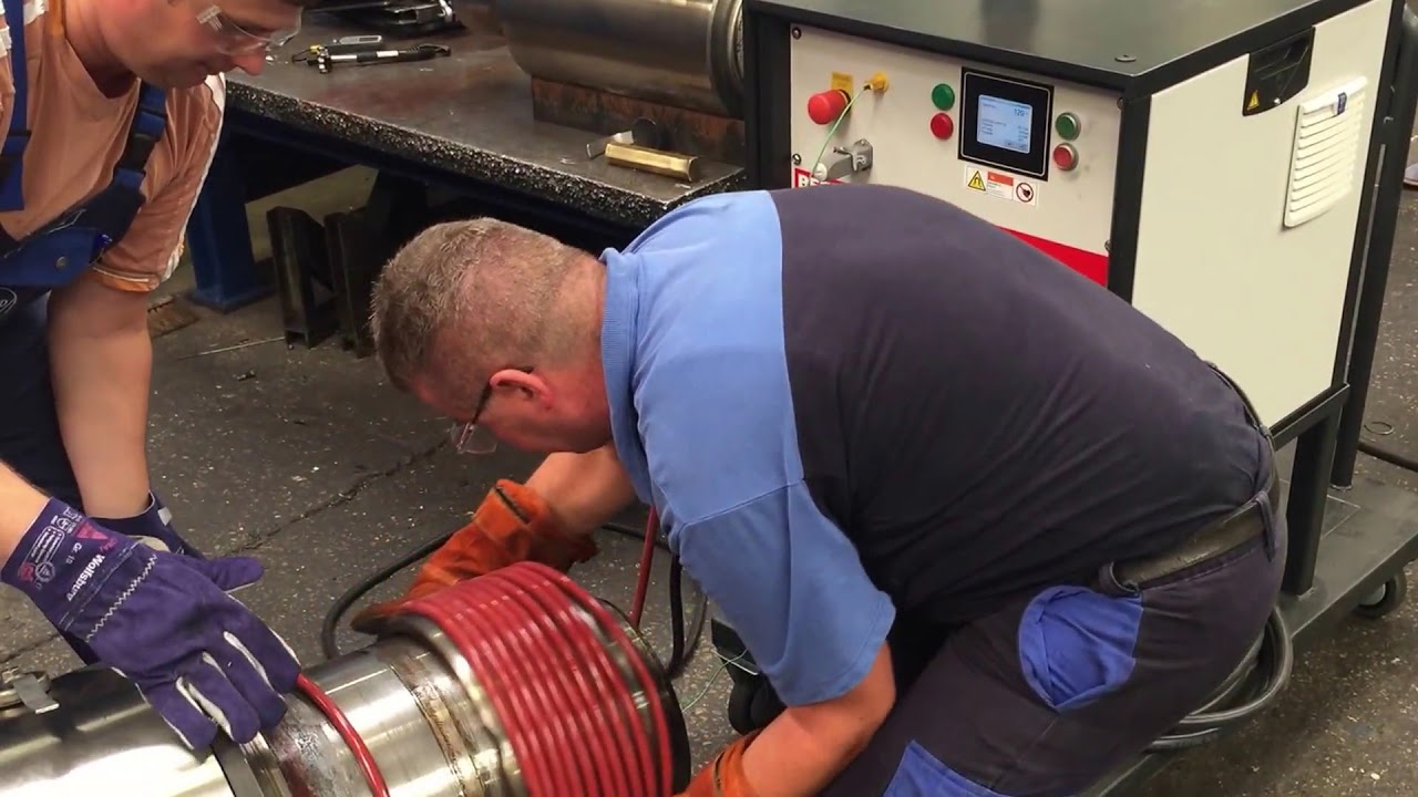 Heating steel bearing sleeves in steel mill with induction, for removal