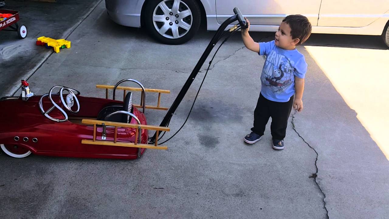 My son hitting his switches on his pedal car YouTube