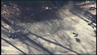 Bomb squad robot detonating suspicious bags