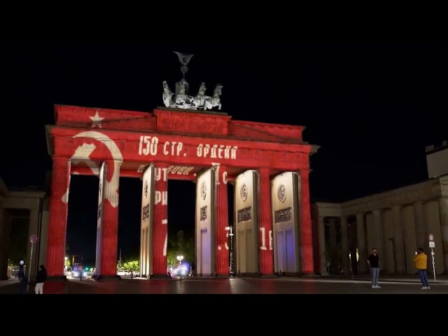 Hackers breach the projection on the Brandenburg Gate in Berlin and put up the Soviet victory banner class=
