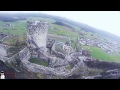 Long Range FPV cruising along natural wall with a medieval castle.