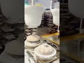 The process of making motifs on ceramic bowls using giant silicone stamps in the factory #shorts