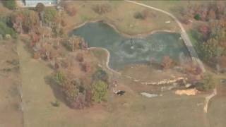 Crews work to fight brush fires from the air