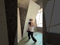 Woman Tiling a Wall Like a Pro
