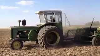 John Deere 820 tractor pulling drill