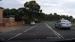 Silver top taxi drive over two blend lines because he think he above the law