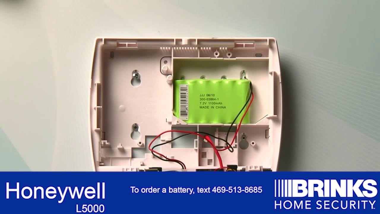Hvordan endrer jeg batteriet i Honeywell Security System?