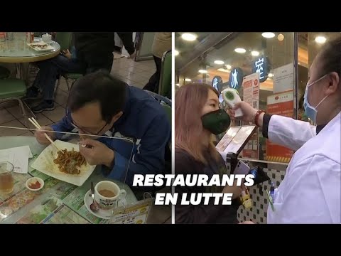 Contre le coronavirus, des restaurants de Hong Kong font manger leurs clients derrière une vitre Contre le coronavirus, des restaurants de Hong Kong font manger leurs clients derrière une vitre