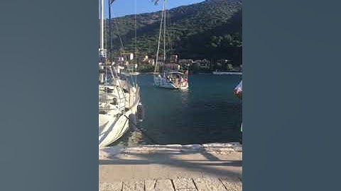 Windy docking sailboat. Med mooring.