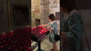 The Meaning and History Behind Lighting a Candle for Loved Ones in Church