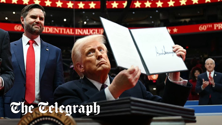 Trump signs executive orders and throws pens into crowd live on stage