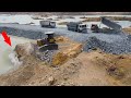 Great working bulldozer push stone with dump truck transport stone build road connect to other route