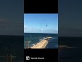 Awesome over-the-pier jump by kite surfer #shorts