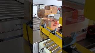 Fully Automatic Flap-Folding Carton Sealer for Fast Packaging and Shipping.