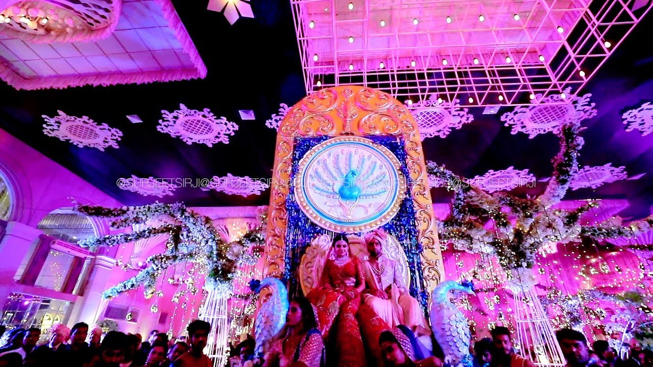 Ritz gurgoan | A Grand White Peacock Bride & Groom Varmala I New Entry concept By Surjeet Sir Ji