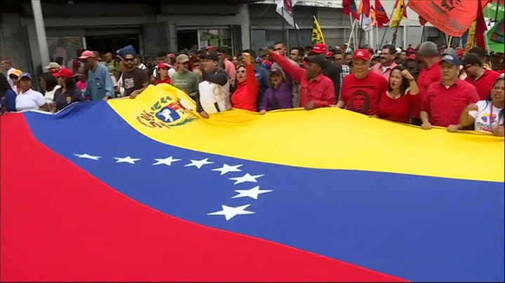 Gobierno y oposición a las calles en una Venezuela sitiada por los apagones